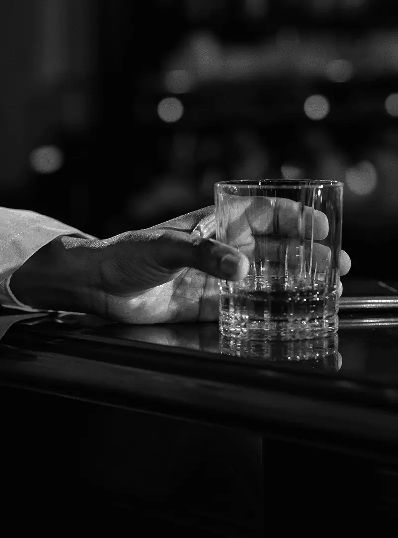 Close-Up Photo of Person Holding Clear Drinking Glass